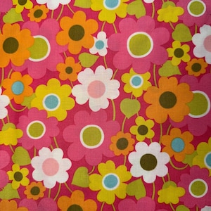 May include: A vibrant floral pattern featuring large, stylized flowers in shades of pink, orange, yellow, and white against a bright pink background. Green leaves and smaller flowers add detail to the design. This pattern is suitable for fabric or wallpaper.