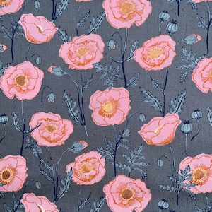 May include: A fabric with a repeating floral pattern featuring pink poppies with orange centers and gold accents. The flowers are set against a dark gray background with blue-green stems and leaves. The design includes poppy seed pods.
