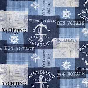 May include: Nautical-themed fabric with a repeating pattern of anchors, compasses, and ship wheels in white on a blue and navy background. The fabric includes text such as "Bon Voyage," "Yachting Company," and "Wind Spirit est 1970."