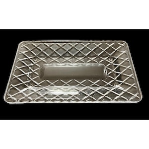 May include: Clear rectangular serving tray with a diamond pattern and a rectangular handle. The tray is made of a transparent material, likely glass or plastic, and is designed for serving food or displaying items.