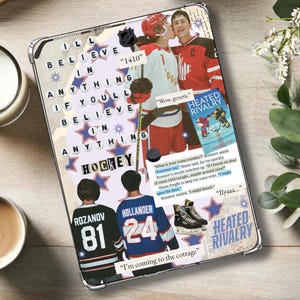 May include: A rectangular tablet case featuring a collage of hockey-themed imagery, including two players in jerseys, text reading I'll believe in anything if you'll believe in anything hockey, and book excerpts from Heated Rivalry with ice skates.