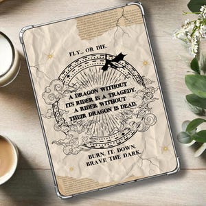 May include: A white phone case with a black and white illustration of a dragon and clouds. The text "FLY... OR DIE." is at the top of the case. The text "A DRAGON WITHOUT ITS RIDER IS A TRAGEDY. A RIDER WITHOUT THEIR DRAGON IS DEAD." is in the center of the case. The text "BURN. IT. DOWN. BRAVE THE DARK." is at the bottom of the case.