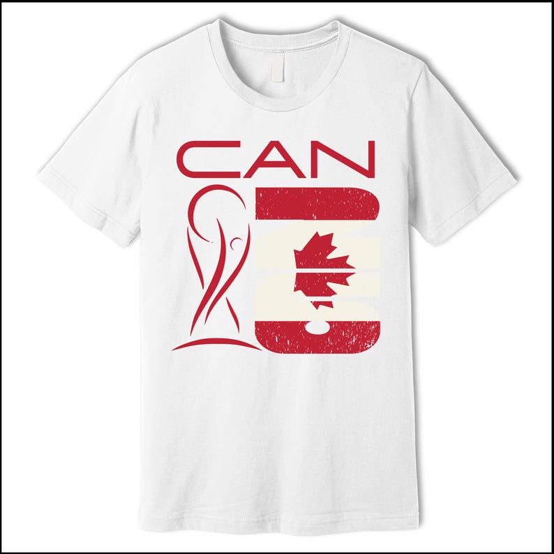 May include: White t-shirt with a red graphic design. The design features the word "CAN" above a stylized image of the Canadian flag. The shirt has a crew neck and short sleeves.