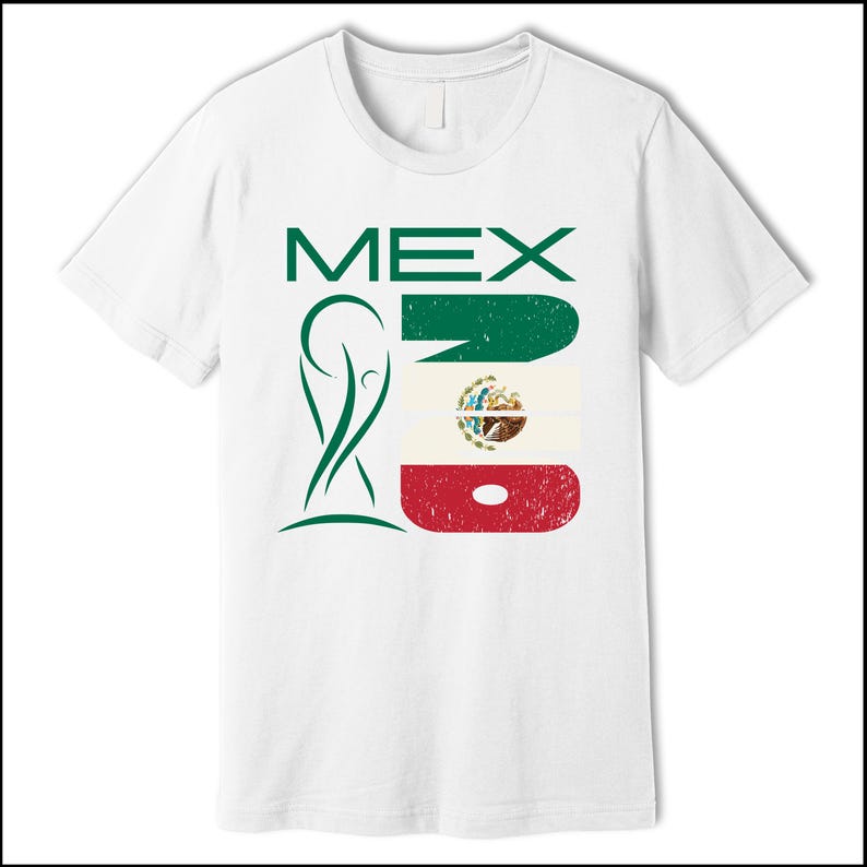 May include: White t-shirt featuring the word "MEX" in green block letters, alongside a stylized green emblem and a distressed Mexican flag design. The shirt is a classic crew neck style.