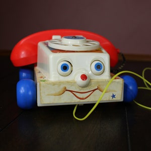 Vintage 1985 Fisher Price Rotary Telephone Pull Toy With Receiver, Telephone  Sound Effects and Eyes That Move When Phone is Rolling 