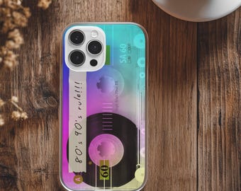 May include: Clear phone case featuring a retro cassette tape design with the text "80's 90's rule!!!". The case has a gradient background of blue, purple, and yellow. The cassette tape graphic includes the text "SA 60".