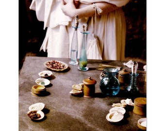 A Lady Considers Her Lotions- matte photographic print of a Roman lady using natural beauty products