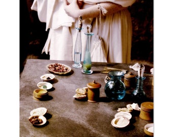 A Lady Considers Her Lotions- semi-gloss photographic print of a Roman lady using natural beauty products