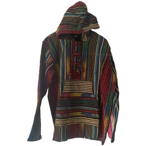 May include: A colorful, hooded poncho with a striped pattern in shades of red, blue, green, and yellow. The poncho features a front pocket and a drawstring closure at the neck. The fabric appears to be woven.