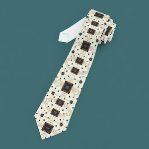 May include: A cream-coloured tie featuring a repeating pattern of computer chip designs in brown and black. The tie has a white backing and is angled against a teal background. The design is reminiscent of circuit boards.
