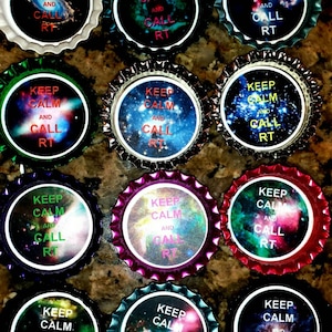 May include: Twelve bottle caps with a galaxy background and the text "Keep Calm and Call RT" in white and red lettering.