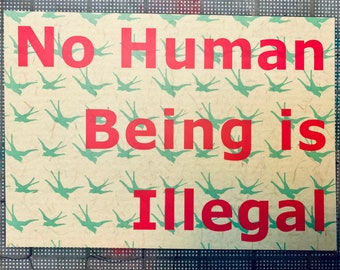 No human being is illegal postcard