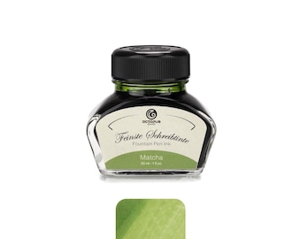 May include: A glass bottle of Octopus Fluids fountain pen ink with a black screw cap. The label reads "Feinste Schreibtinte", "Fountain Pen Ink", "Matcha", and "30 ml - 1 fl.oz". Below the bottle is a green ink swatch showing the color.