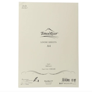 May include: A pack of 100 loose sheets of cream-colored paper from Tomoe River. The paper is 52 grams per square meter and is made in Japan. The pack is labeled "Loose Sheets A4" and "Paper Color: CREAM".