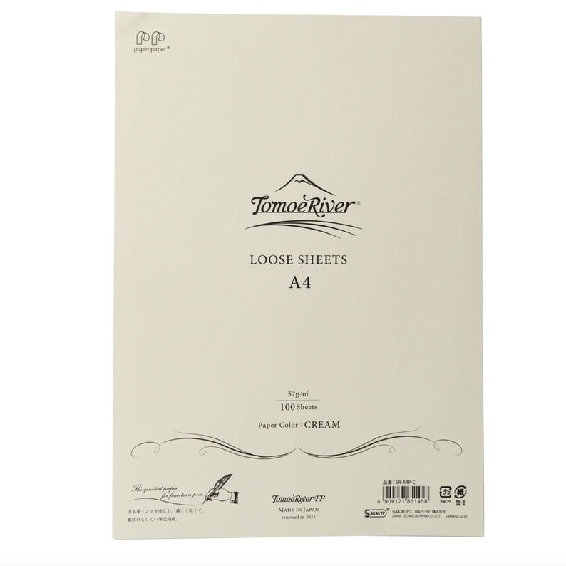 May include: A pack of 100 loose sheets of cream-colored paper from Tomoe River. The paper is 52 grams per square meter and is made in Japan. The pack is labeled "Loose Sheets A4" and "Paper Color: CREAM".