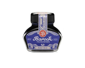 May include: A glass bottle of blue fountain pen ink with a black screw cap. The label features the text Barock, Füllhaltetinte, 1957, 2025, Blau, 30 ml, and Limiterte Edition. The bottle has a wide base and a decorative blue and white art deco pattern.