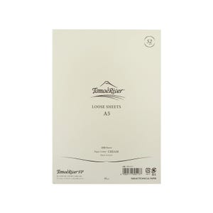 May include: A pack of 100 loose sheets of cream-colored paper from Tomoe River. The paper is A5 size and is made in Japan. The pack has the text "Tomoe River FP" and "SAKAE TECHNICAL PAPER" printed on it.