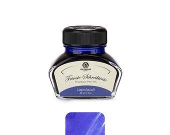 May include: A glass bottle of Lapis lazuli fountain pen ink with a black screw cap. The label reads Octopus Fluids, Feinste Schreibtinte, Fountain Pen Ink, Lapis lazuli, 30 ml - 1 fl. oz. A blue ink swatch is displayed below the bottle.