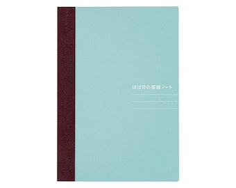 May include: A rectangular notebook with a light blue cover and a dark maroon textured spine. The front cover features white Japanese text that reads ほぼ日の罫線ノート, positioned above three thin, horizontal white lines.