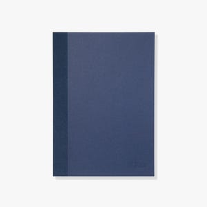 May include: A rectangular notebook with a solid dark blue cover and a textured vertical spine strip in a slightly darker shade of blue. The front cover features a subtle, embossed logo in the bottom right corner, maintaining a clean design.