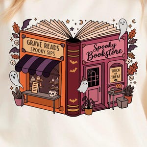 May include: Cream-colored t-shirt featuring a whimsical illustration of a book split into two shops: "Grave Reads Spooky Sips" and "Spooky Bookstore." The design includes ghosts, bats, and the words "Trick or Treat."