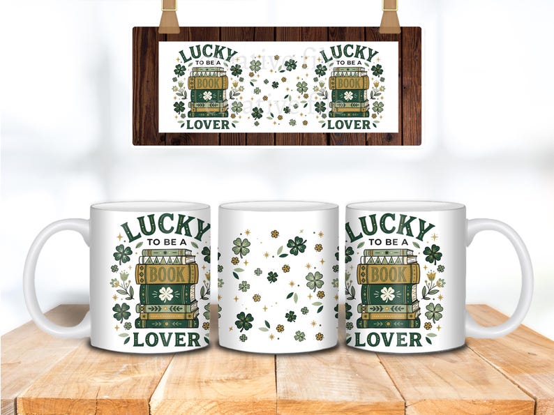May include: White ceramic mugs with a "Lucky to be a Book Lover" design. The design includes stacks of books, shamrocks, and floral elements in green, gold, and white. A wooden sign with the same design hangs above the mugs.