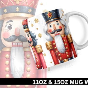 May include: A white ceramic mug featuring a festive Nutcracker design. The mug showcases a red and gold Nutcracker soldier with a black hat and a white beard. Gold snowflakes and the text "11OZ & 15OZ MUG WRAP" are also visible.