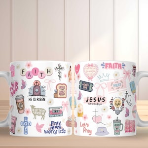 May include: White ceramic mug decorated with various religious-themed graphics, including the word "FAITH", a cross, and the phrase "HE IS RISEN". The mug features pink, blue, and brown accents, and is suitable for hot or cold beverages.