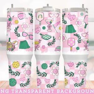 May include: Three pink and white stainless steel tumblers with a checkered pattern and a variety of designs including paddles, hearts, and flowers. The tumblers have a lid and a handle.