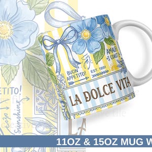 May include: White ceramic mug with a wraparound design featuring blue floral illustrations, a blue bow, and the words "LA DOLCE VITA" and "BUON APPETITO!". The mug also has the text "AMALFI COAST EST. 1991".