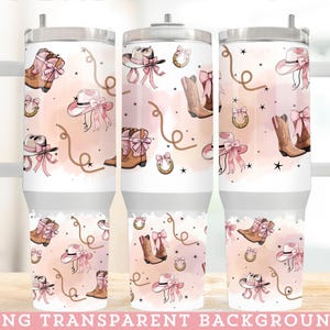 May include: A set of three pink and white tumbler cups with a cowgirl theme. The tumblers feature a pink and white pattern with cowboy boots, hats, and horseshoes. The tumblers are perfect for everyday use or for special occasions.