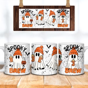 May include: White ceramic mugs with a Halloween-themed design. Each mug features a cartoon ghost wearing an orange beanie and holding a pumpkin or a beverage. The words "Spooky Brew" are printed on the mugs.