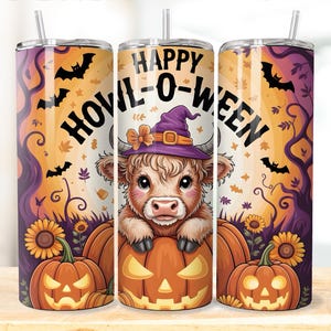 May include: A Halloween-themed tumbler featuring a cartoon cow wearing a witch hat, emerging from a carved pumpkin. The design includes bats, sunflowers, and the text "HAPPY HOVIL-O-WEEN" against an orange and purple background.