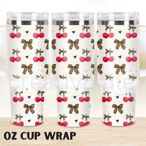 May include: Three 40 ounce stainless steel tumblers with a white background and a pattern of red cherries and leopard print bows. The tumblers are for sublimation.