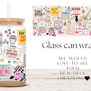 May include: A clear glass can-shaped tumbler with a bamboo lid and straw, featuring a colorful sticker-style collage print. Graphics include a typewriter, a goose, smiley faces, and text such as "not my problem" and "I GLADLY WILL."