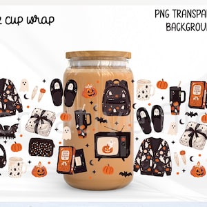 May include: A 16 oz glass cup with a bamboo lid featuring a Halloween-themed wrap design. The pattern includes black cardigans, pumpkins, ghosts, slippers, a backpack, a vintage television, mugs, and books with the text Spook House Scream 95.