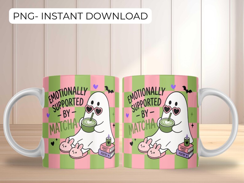 May include: Two white ceramic mugs featuring a pink and green checkered pattern. The design includes a white ghost wearing heart-shaped sunglasses, holding a green matcha drink, wearing bunny slippers, and sitting by books with text: EMOTIONALLY SUPPORTED BY MATCHA.