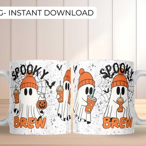 May include: White ceramic mug with a Halloween-themed design. The mug features a cartoon ghost wearing an orange beanie and holding a drink. The words "Spooky Brew" are printed in orange, along with bats and a spiderweb.