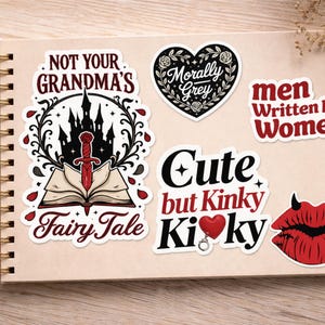 May include: A collection of stickers with various designs and text. One sticker reads "NOT YOUR GRANDMA'S Fairy Tale" with a castle and sword. Other stickers say "Morally Grey", "men Written by Women", "Cute but Kinky KiKy", and a pair of red devil lips.