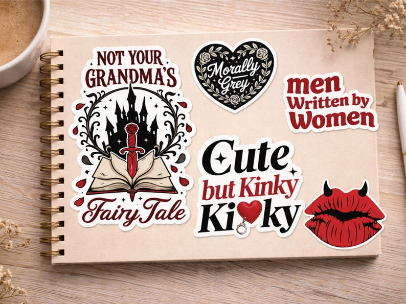 May include: A collection of stickers with various designs and text. One sticker reads "NOT YOUR GRANDMA'S Fairy Tale" with a castle and sword. Other stickers say "Morally Grey", "men Written by Women", "Cute but Kinky KiKy", and a pair of red devil lips.