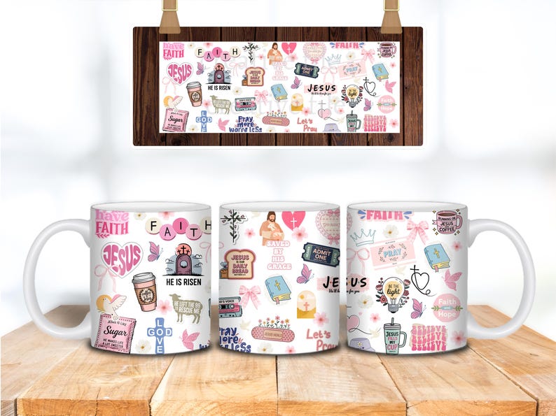 May include: White ceramic mugs with a religious theme. Each mug features a collage of pink and white graphics, including the words "Faith," "Jesus," and other inspirational phrases. The mugs are decorated with crosses, hearts, and floral elements.