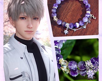 May include: A purple beaded bracelet with silver accents and star charms. The bracelet features round, polished beads in varying shades of purple. A silver chain with star-shaped charms dangles from the bracelet. The image also includes a portrait of a person.