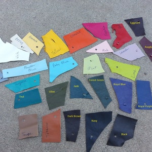 May include: Leather swatches in various colors, including teal, powder blue, baby blue, mint, forest green, jade, royal blue, olive, dark brown, navy, black, lime, eggplant, raspberry, beige, banana, orange, yellow, pink, and lavender.