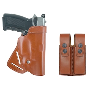 May include: A brown leather holster for a handgun with a double magazine pouch. The holster has a belt loop and a snap closure. The magazine pouch has two separate compartments.