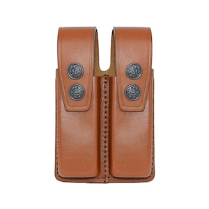 May include: A brown leather double magazine pouch with metal snaps.