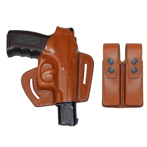 May include: A brown leather holster for a handgun with a magazine pouch. The holster has a belt loop and a snap closure. The magazine pouch has a snap closure.