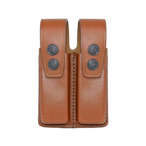 May include: A brown leather double magazine pouch with metal snaps.