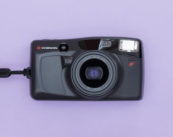 Cámara compacta de película de 35 mm de apuntar y disparar con zoom de bolsillo Chinon