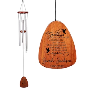 May include: Wooden wind chime with a teardrop-shaped plaque that reads "Goodbyes are not forever, Goodbyes are not the end, They simply mean we'll miss you, Until we meet again, Sarah Jackson, 1956-2022".