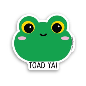 May include: Green frog sticker with big eyes and a smile. The sticker says "TOAD YA!"
